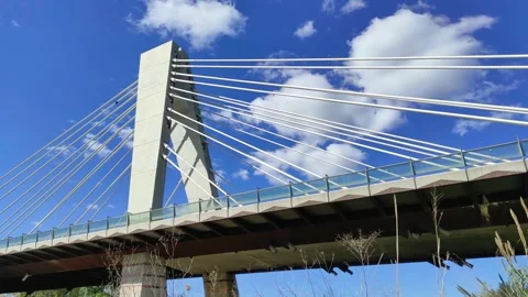 Modern bridge on the background of blue sky, time lapse Stock Footage 164651852