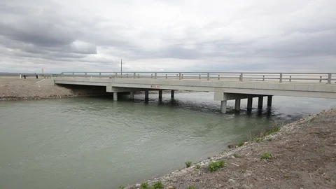 Modern bridge crossing an Alberta river Stock Footage 90837353
