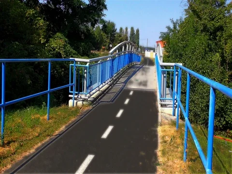 Modern Bridge on the River and Cycle Route, light fx Stock Footage 73198848