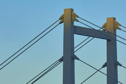 A modern bridge at sunset with clear cable structures and a cloudless sky, Foto stock