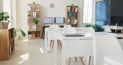 Modern bright classroom interior with white desks, chairs and computers for Stock Footage 341176728