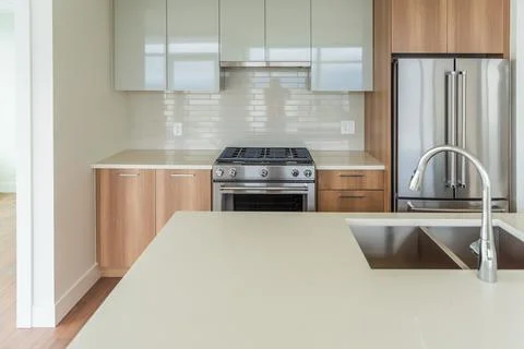 Modern, bright, clean empty kitchen interior with stainless steel appliances  Stock Photos