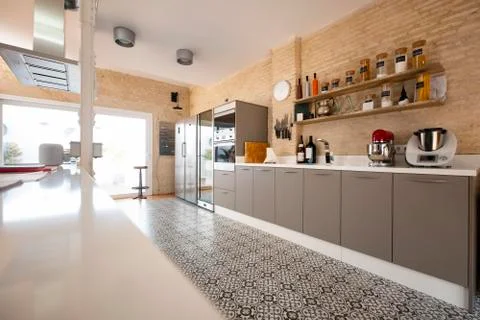 Modern, bright, clean, kitchen interior with stainless steel appliances in a Stock Photos