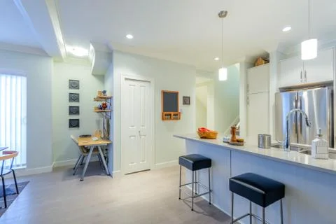 Modern, bright, clean, kitchen interior with stainless steel appliances in a  Stock Photos