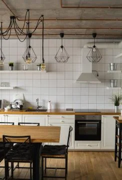 Modern, bright, clean, kitchen interior with stainless steel appliances in a Stock Photos