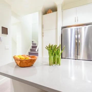 Modern, bright, clean, kitchen interior with stainless steel appliances in a  Stock Photos