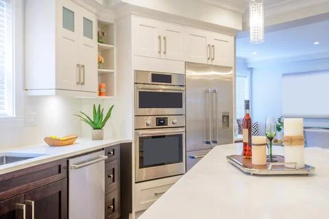 Modern, bright, clean, kitchen interior with stainless steel appliances in a  Stock Photos
