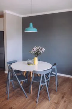 Modern bright interior with dining table Stock Photos