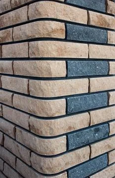 Modern brown brick column, background texture, closeup, decoration Stock Photos