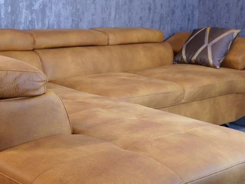 Modern brown leather sofa with soft cushions and elegant texture Stock Photos