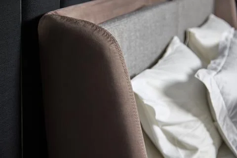 On modern brown sofa there soft pillows with pillowcases made of natural silk Stock Photos