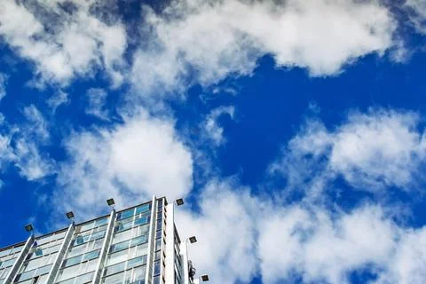 Modern building against blue cloudy sky Fotos Stock