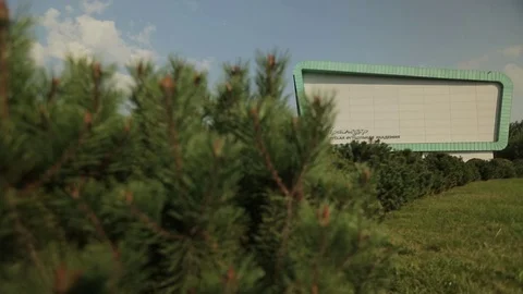 Modern building and a park area in from of it, general shot Stock Footage 75986394