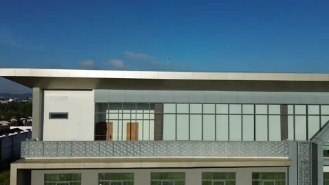 Modern building architecture showcasing a vibrant urban panorama under clea.. Video stock 325262900