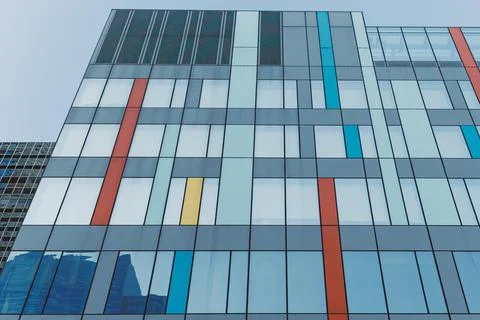 Modern building with colorful window patterns located in an urban area duri.. Foto stock