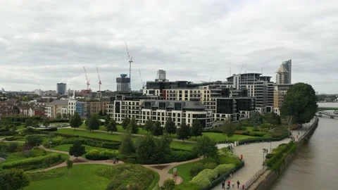 Modern building complex and nice green park at Thames river bank Stock Footage 160226540