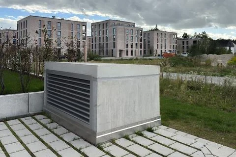 Modern building complex with a grey concrete ventilation structure Stock Photos