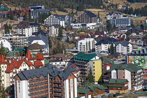 Modern building complex in a mountainous area, a ski resort. Landscape design Stock Photos
