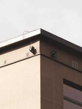Modern building corner with security cameras Fotos de archivo