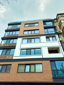 Modern building design with multiple windows and unique colors located in a.. Stock Photos