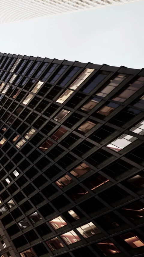 Modern building design with unique structure and glass windows in city Stock Footage 340630884