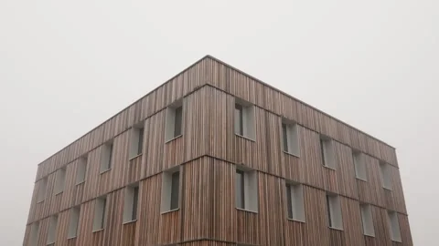Modern building exterior vertical larch wood lamella facade contemporary Stock Footage 332409285