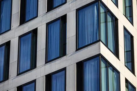 Modern building facade with blue windows Stock Photos