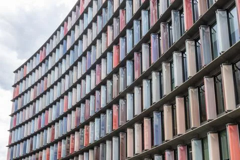 Modern building facade with colorful vertical panels Stock Photos
