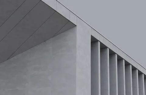 Modern building facade with geometric lines and vertical fins. Minimalist Stock Photos