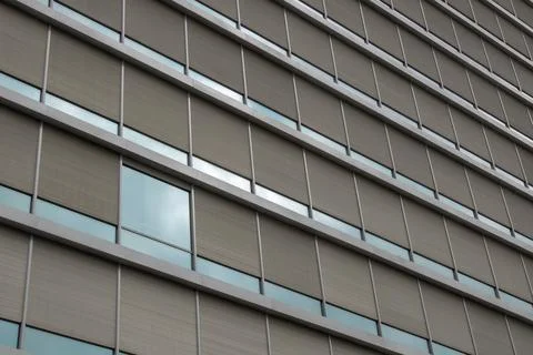Modern building facade with geometric window pattern 写真素材