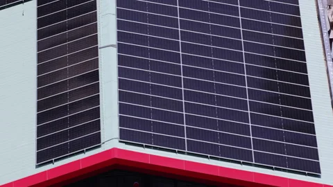 Modern building facade with integrated solar panels for renewable energy Stock-Footage 335364651