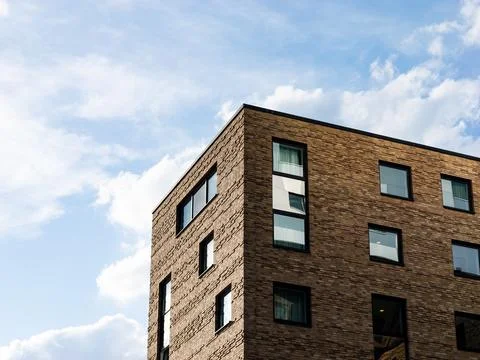 Modern Building Facade with Ochre-Colored Clinker Bricks Fotos de archivo