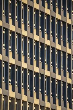 Modern building facade with repetitive windows Stock Photos