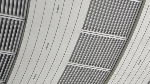 Modern Building Facade with Vertical Architectural Louvers and White Panels Vídeo Stock 346582978
