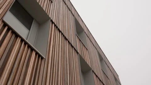 Modern building facade vertical timber slat cladding contemporary architectural Video stock 331837121