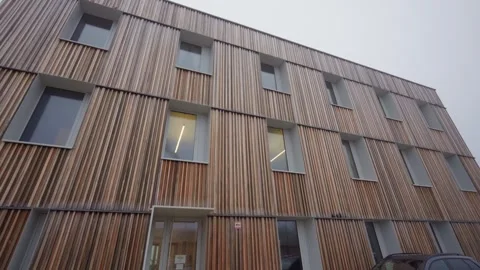 Modern building facade with wood cladding Close up Stockbeeldmateriaal 332433070