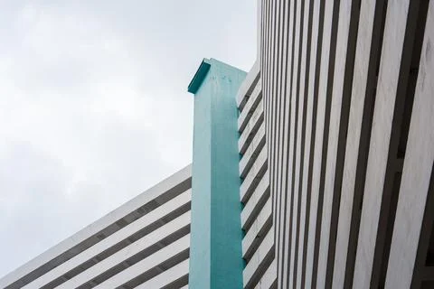 Modern building features bold geometric lines and a striking teal accent Stock Photos