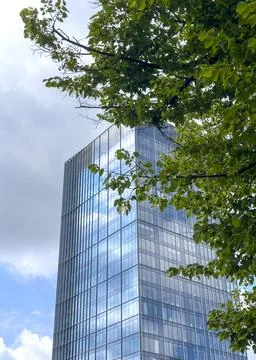 Modern building with green tree elements and glass facades. Eco friendly Stock Photos