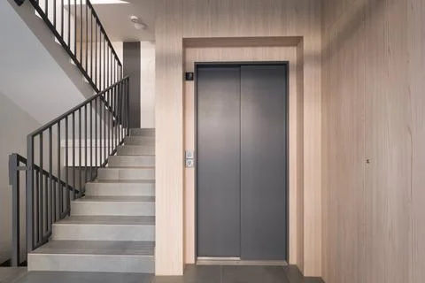 Modern Building Interior with Elevator and Stairs Stock Photos