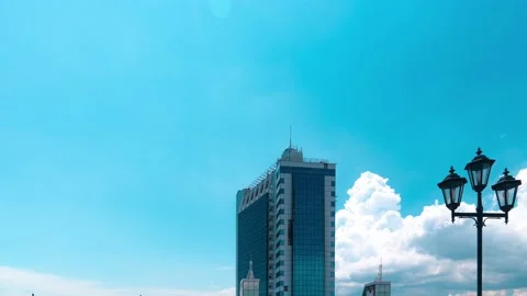 Modern building, large white clouds fly over it in Odessa, Ukraine time lapse. Stock Footage 134174408