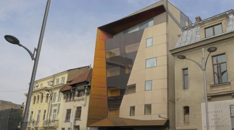 Modern building located between two old buildings in Bucharest Vídeos de archivo 58119294