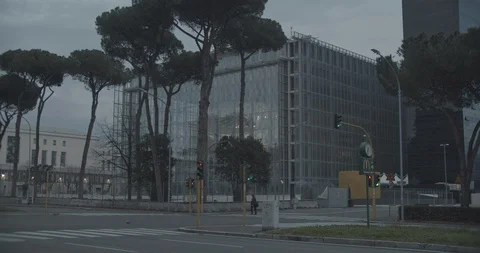 Modern building, one man walking in desert street due to covid-19 lockdown Stock Footage 127840044