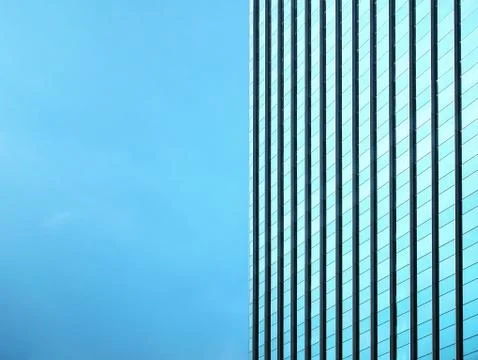 Modern Building with Patterned Window Exterior Against Blue Sky Stock-Fotos