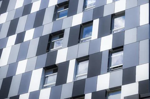 Modern building perspective wall surface and windows gray tile external backg Fotos de archivo