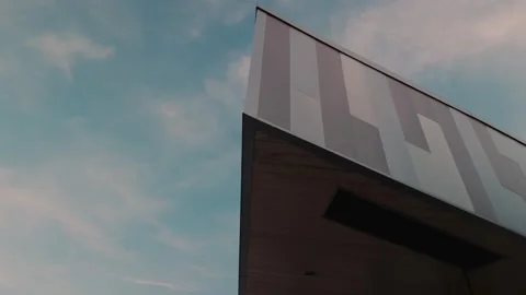 Modern Building Roofline Against Evening Sky With Slow Right to Left Motion Stock Footage 337647257