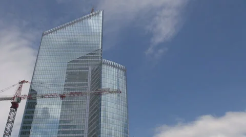 Modern building site construction mirror glass blue sky crane work financial day Stock Footage 34847852