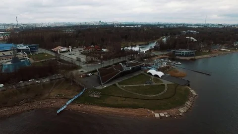Modern building with soil covered roof in city suburb park with open air cinema Stock Footage