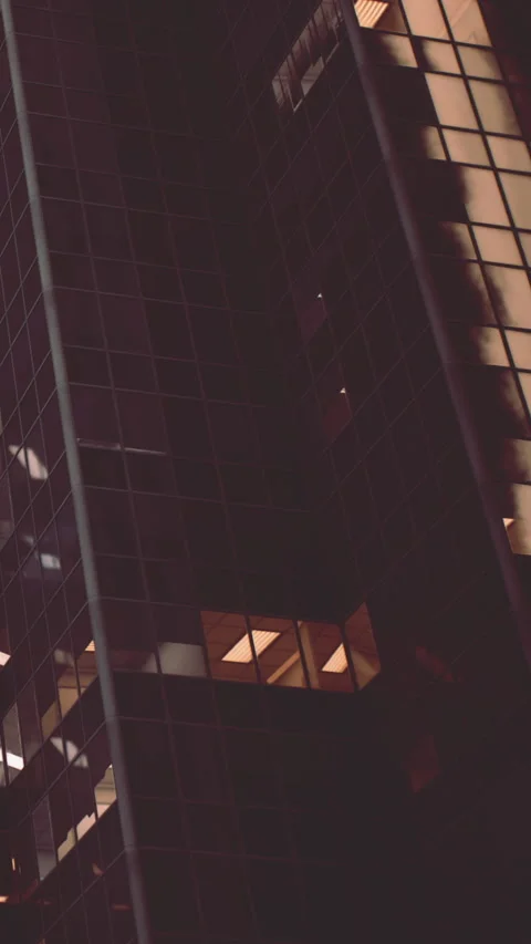Modern building structure with large windows at night in urban area Stock Footage 341989056