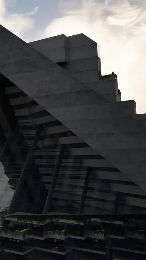 Modern building structure shows angular design in a city landscape during day Stock Footage 335693404