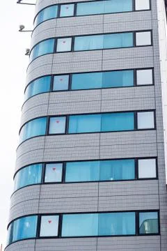 Modern building surface with patterned windows Foto stock
